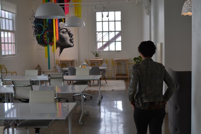 <p>Grace Kraaijvanger, founder of The Hivery, a San Francisco coworking space, walks through an empty location, which will re-open in July.</p>