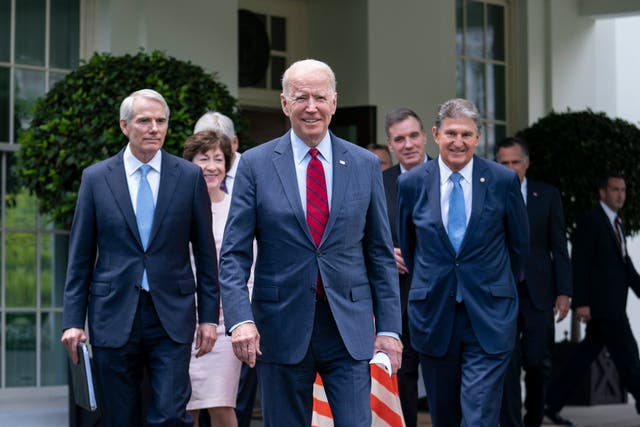 <p>President Joe Biden walks out of the West Wing of the White House following a meeting with a bipartisan group of senators where they reached a deal on an infrastructure plan</p>