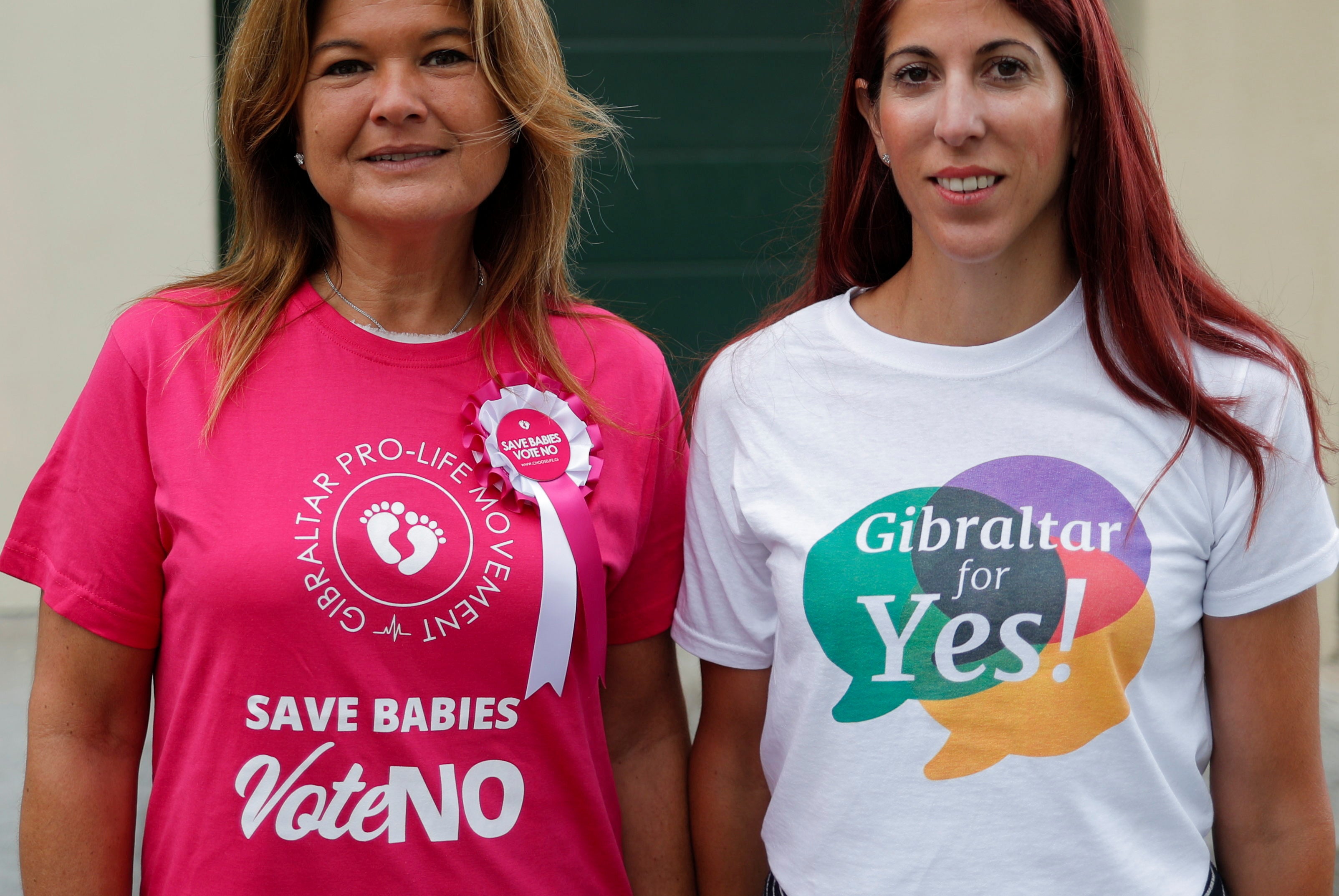 Gibraltarian women from both sides of the campaign outside a polling station on Thursday