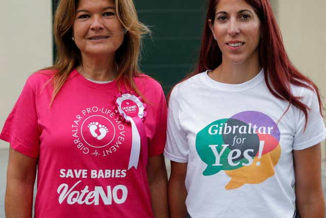 <p>Gibraltarian women from both sides of the campaign outside a polling station on Thursday</p>