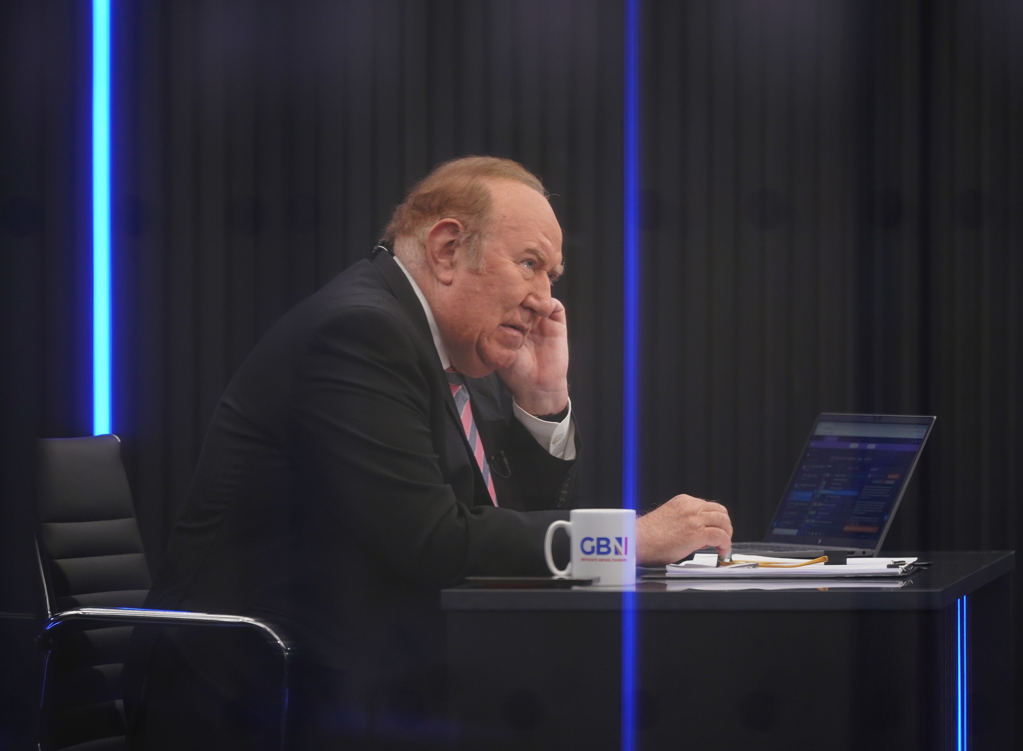 Presenter Andrew Neil prepares to broadcast from a studio during the launch event for GB News