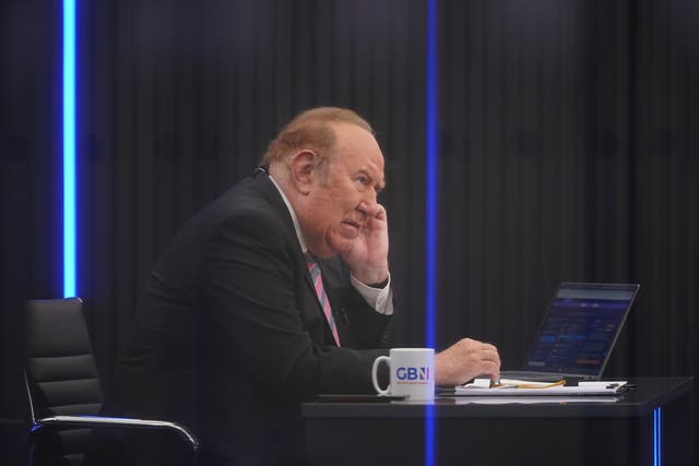 <p>Presenter Andrew Neil prepares to broadcast from a studio during the launch event for GB News</p>
