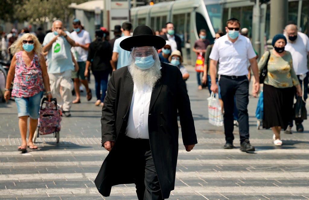 Israel to bring back indoor mask mandate from Sunday, health official says