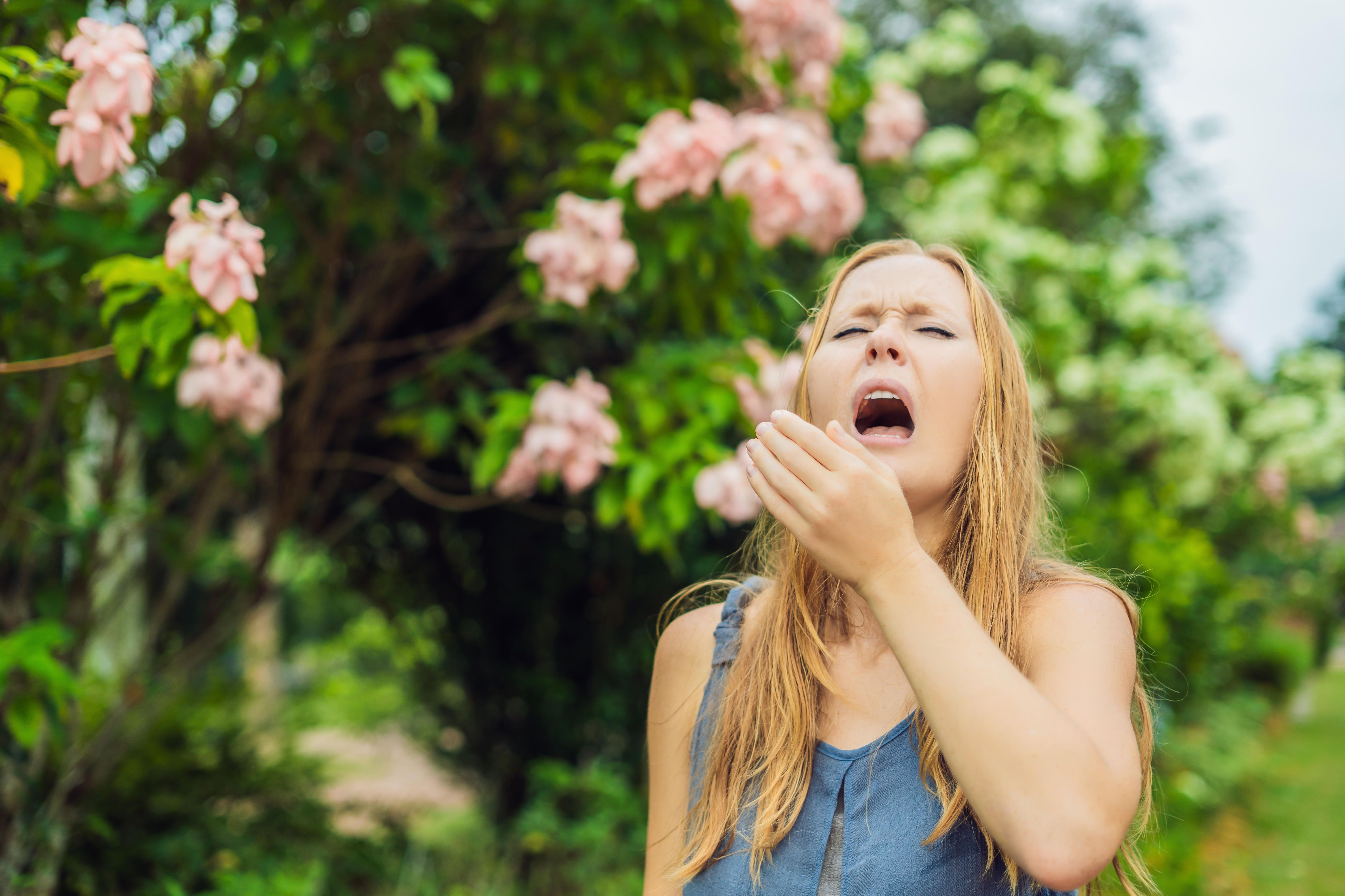 <p>woman sneezing</p>