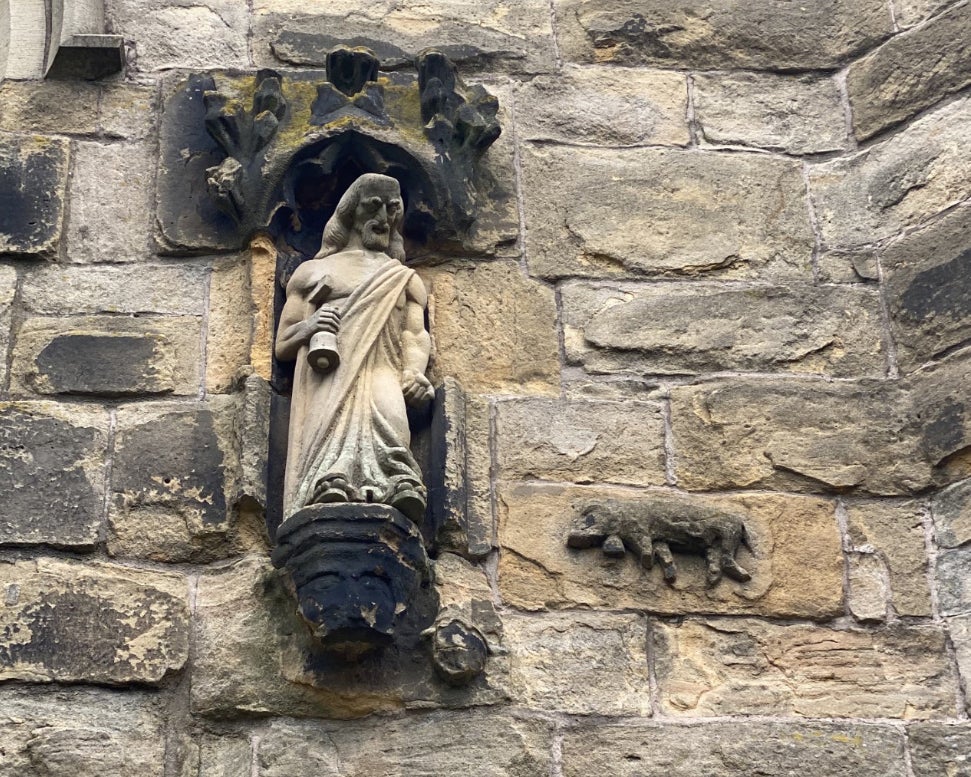 The sculpture of the famous Winwick Pig, with a later statue of St Anthony