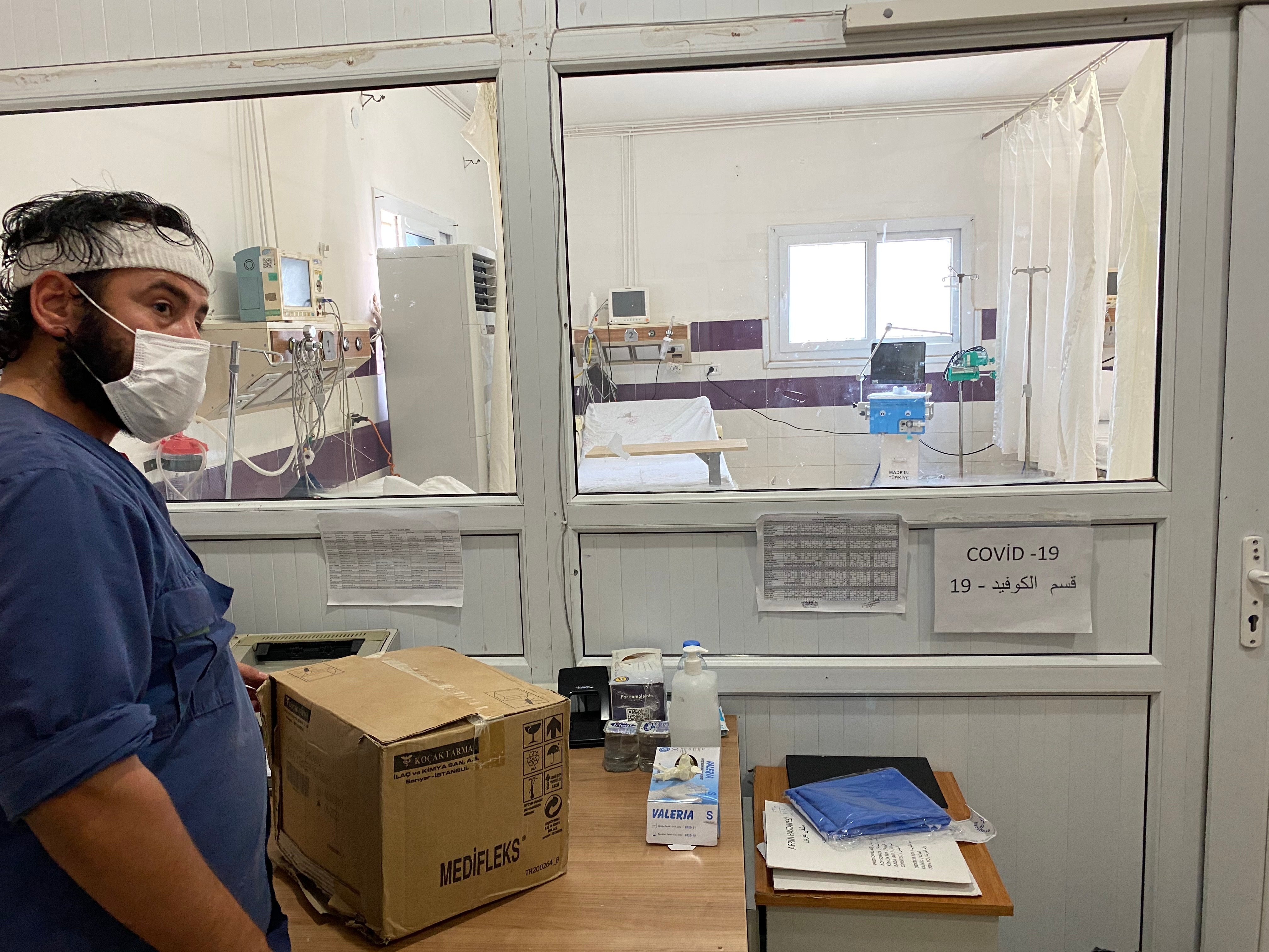 A nurse works outside the Covid ward at the main hospital in Afrin, northwest Syria