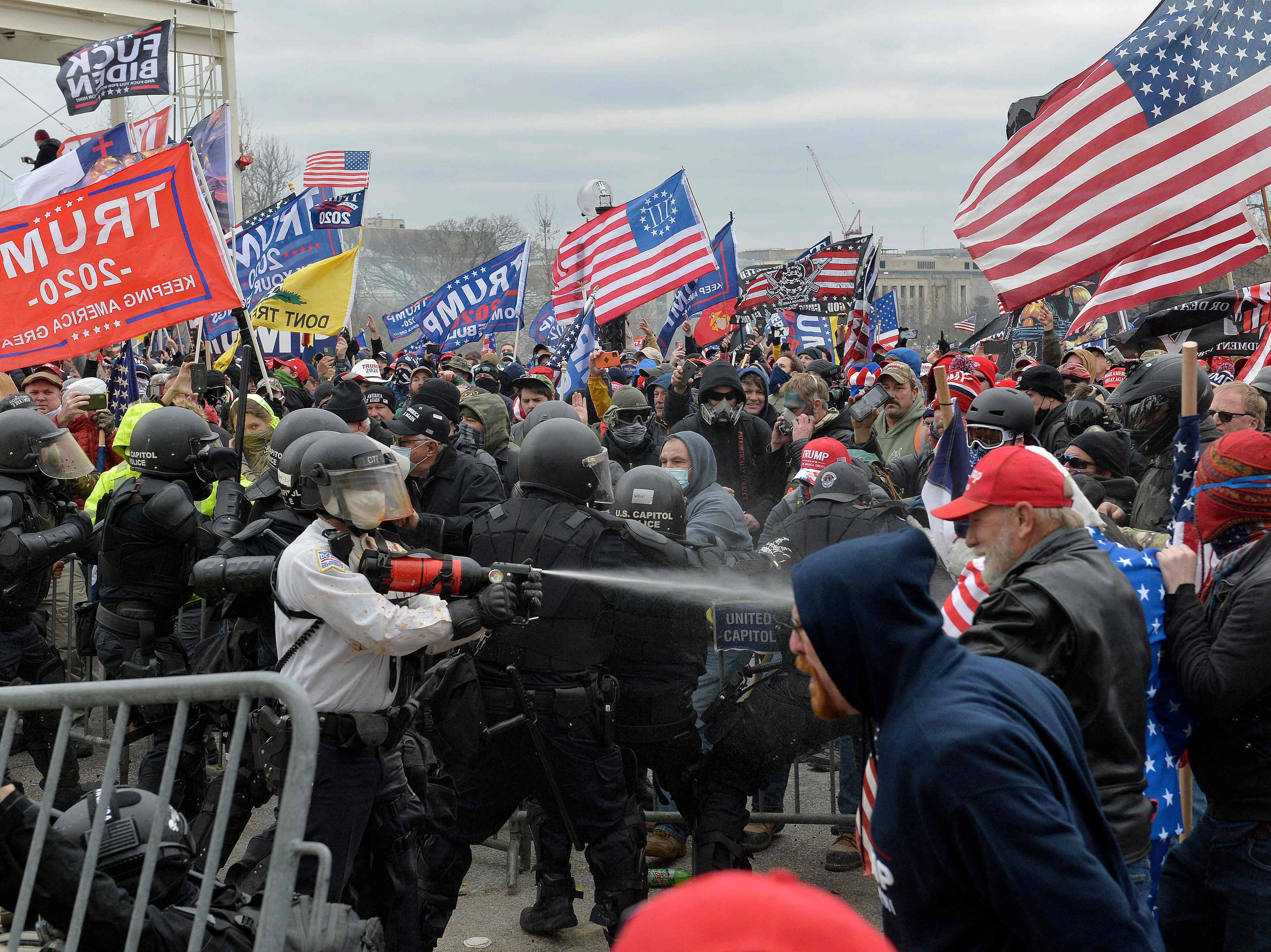 Trump supporters clash with police and security forces as they try to storm the US Capitol in Washington, DC