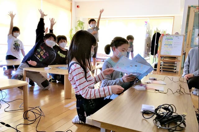 <p>Children take a push-button quiz at the Poppins After-School care center of Nagoya University</p>