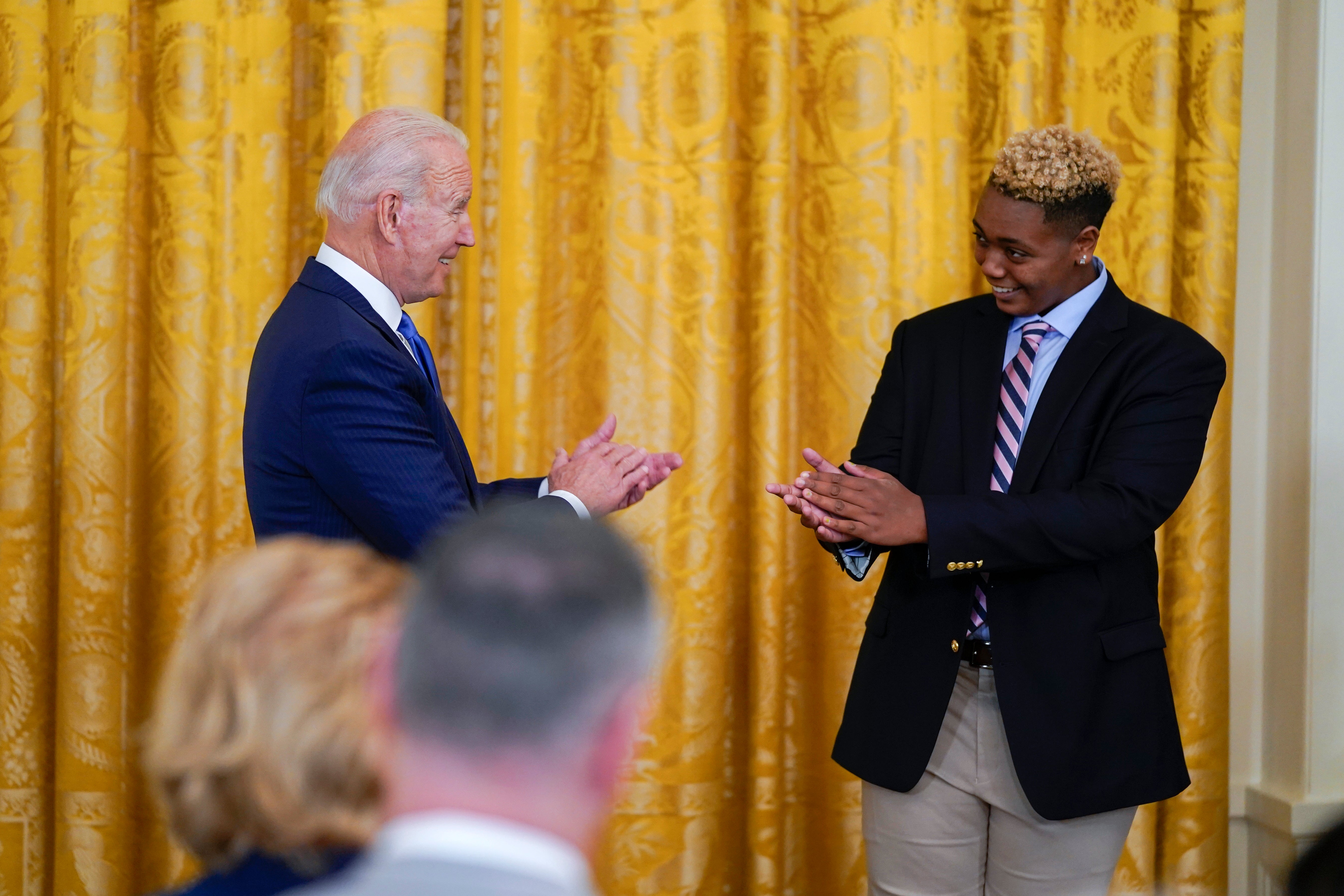 Joe Biden is introduced by 16-year-old Ashton Mota during a White House Pride event.