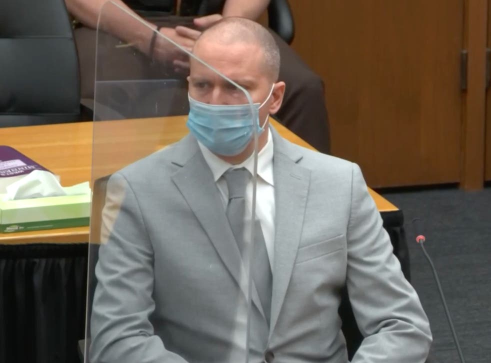 <p>Derek Chauvin listens to his mother’s statement during his sentencing for the murder of George Floyd</p>