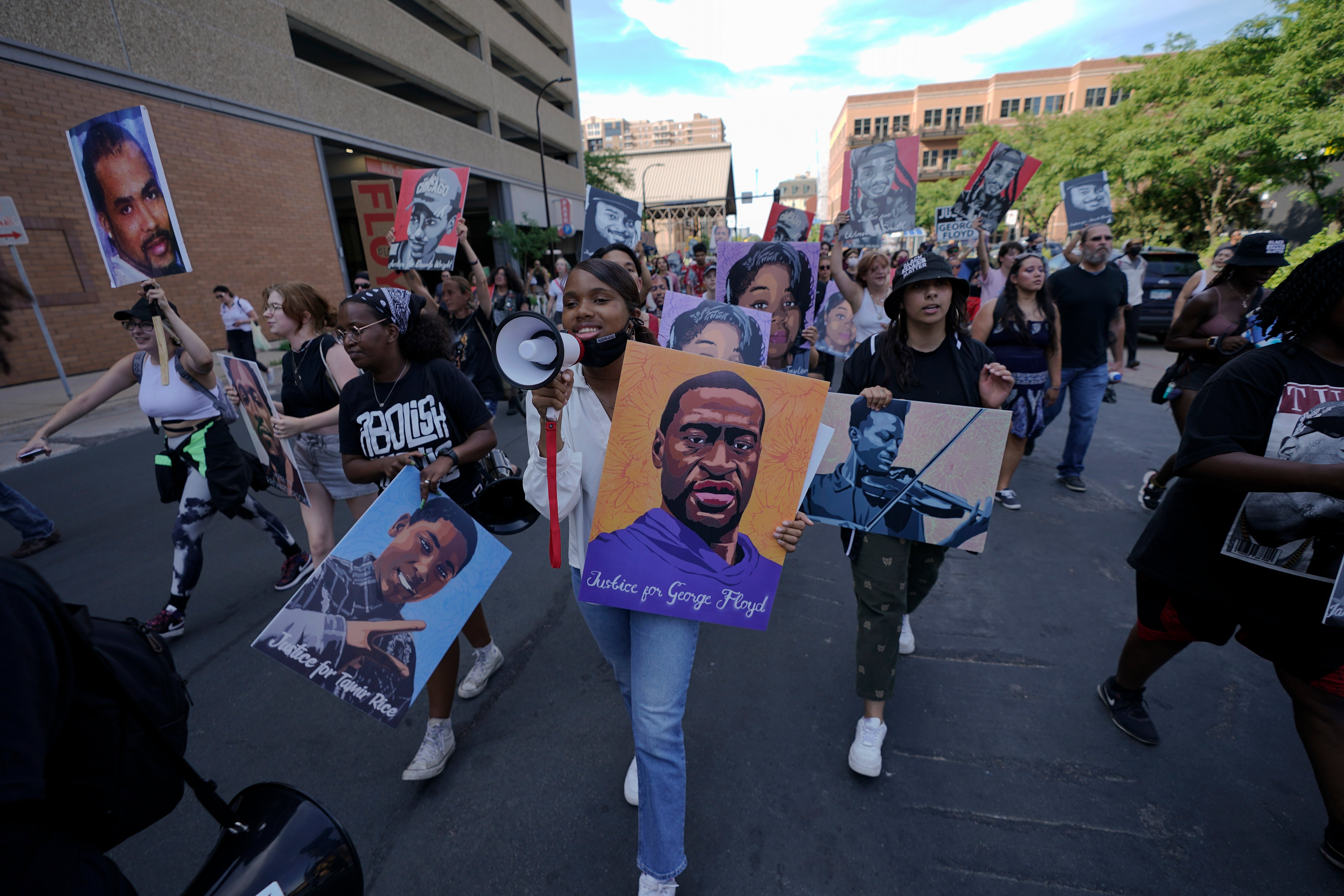 A small group of protesters march in downtown Minneapolis