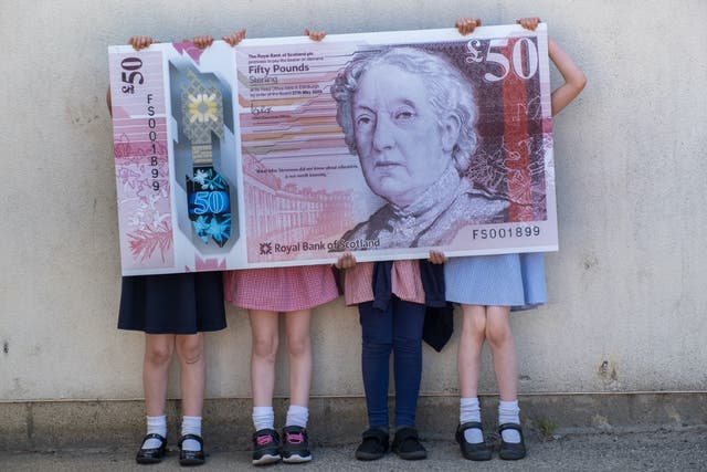 School pupils with banknote