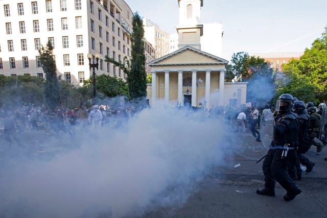 <p>Police officers wearing riot gear push back demonstrators shooting tear gas next to St. John's Episcopal Church outside of the White House, June 1, 2020 in Washington D.C.</p>