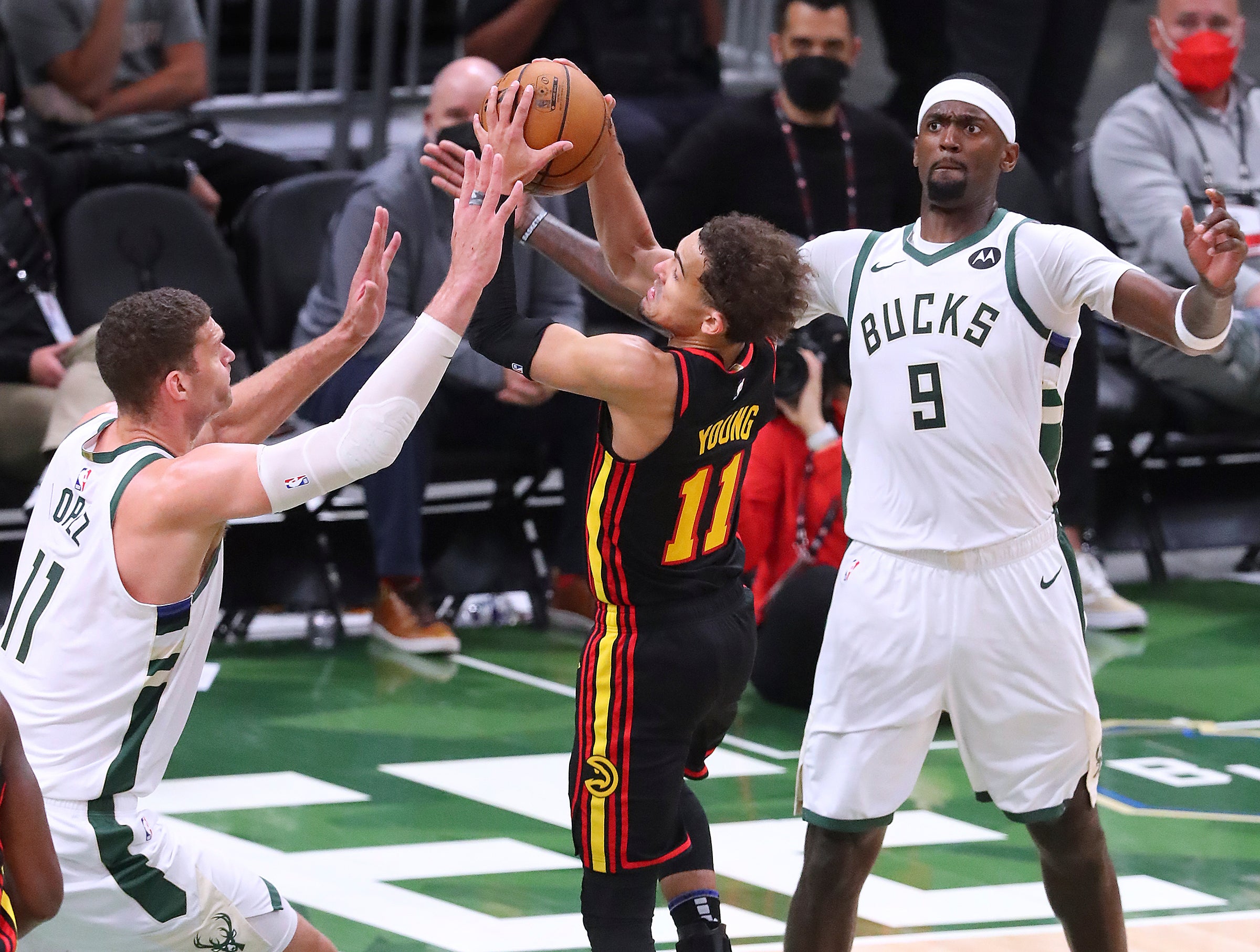 Brook Lopez, left, forces a turnover