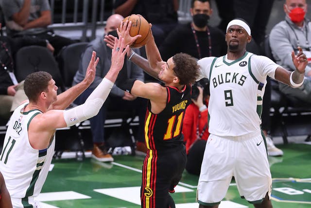 <p>Brook Lopez, left, forces a turnover</p>