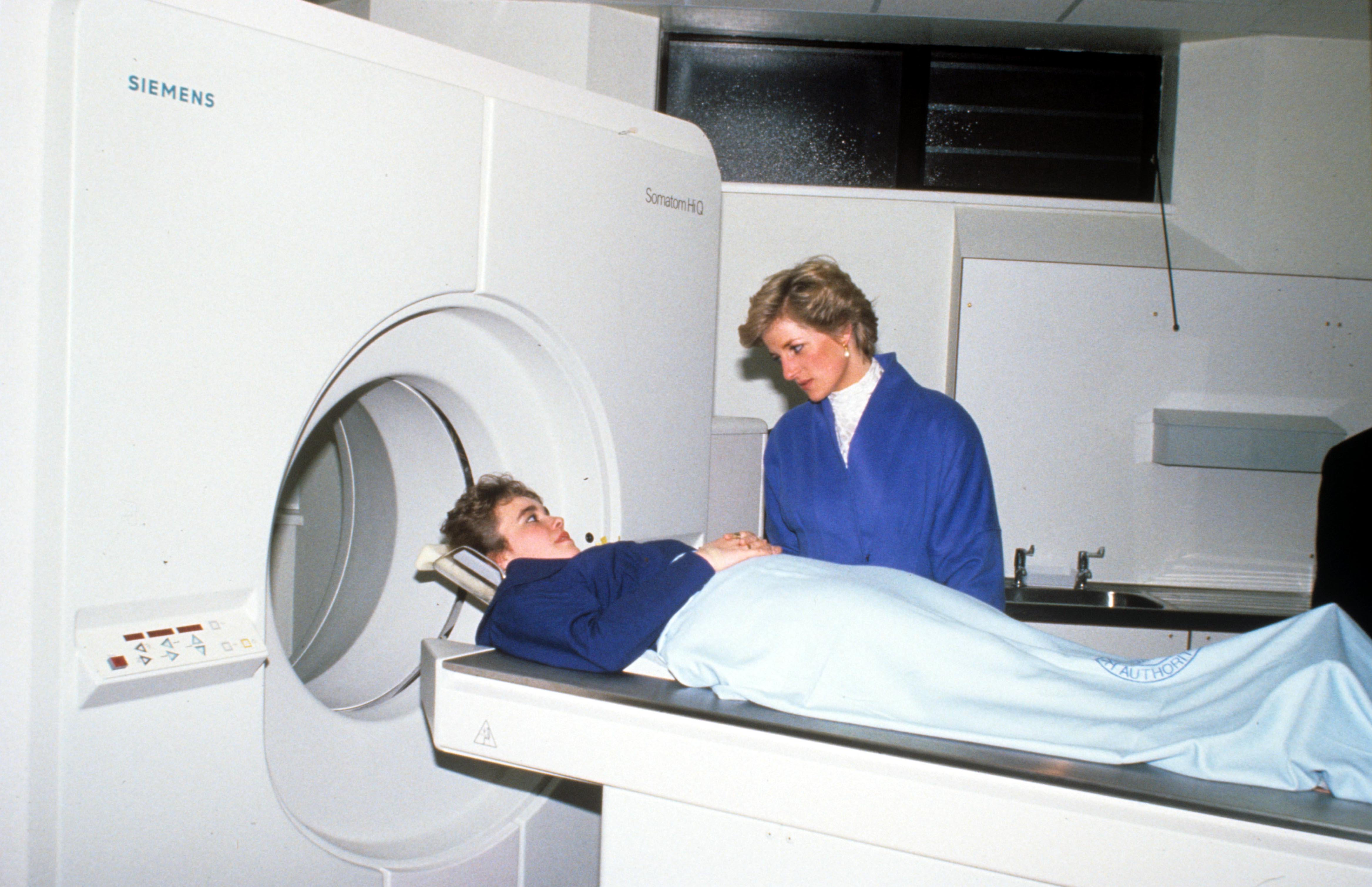Princess Diana with a patient at the opening of the George Thomas Scanner Suite, The Princess of Wales Hospital in Bridgend, Wales in 1990.