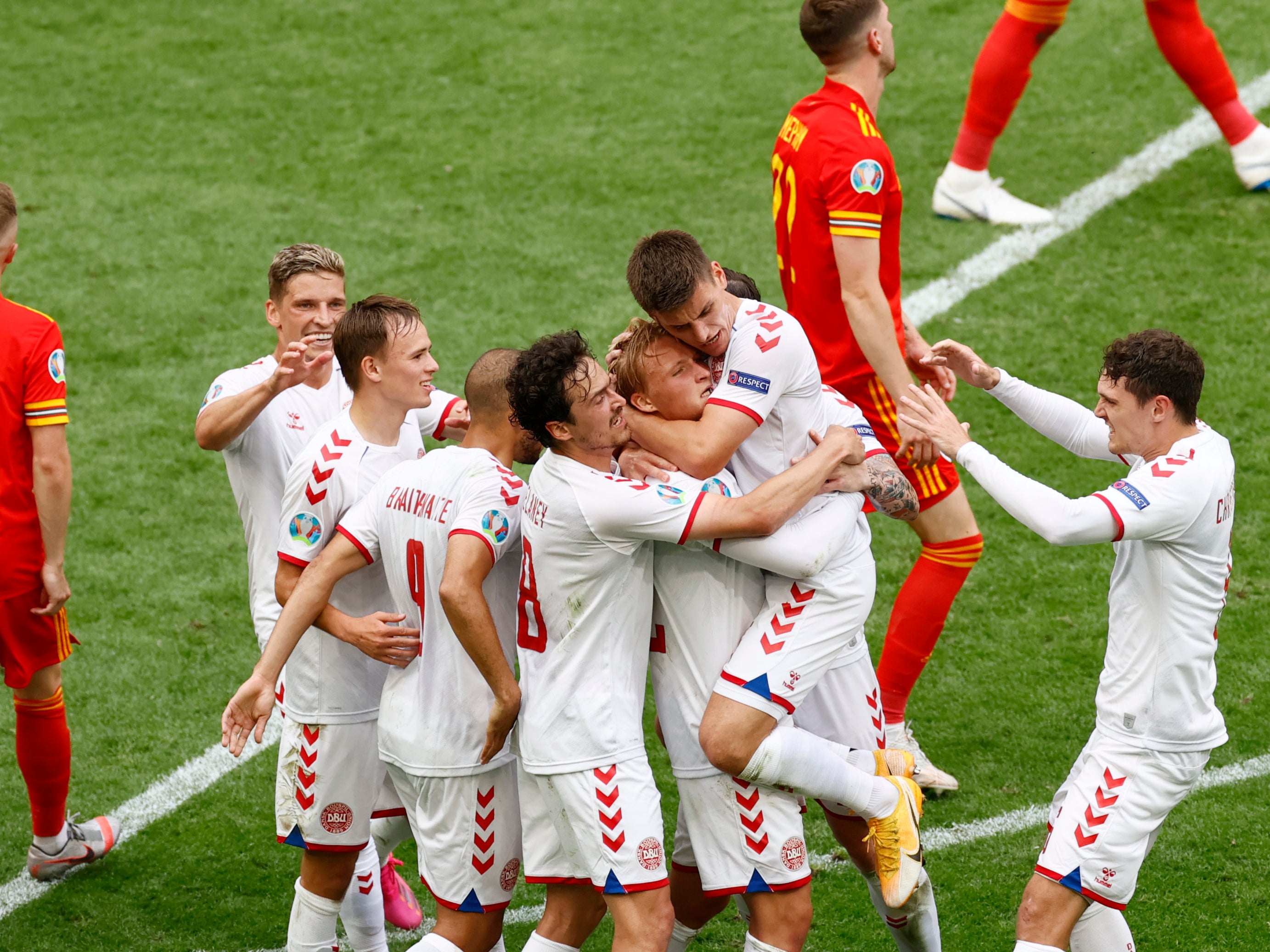 Kasper Dolberg of Denmark celebrates with his teammates