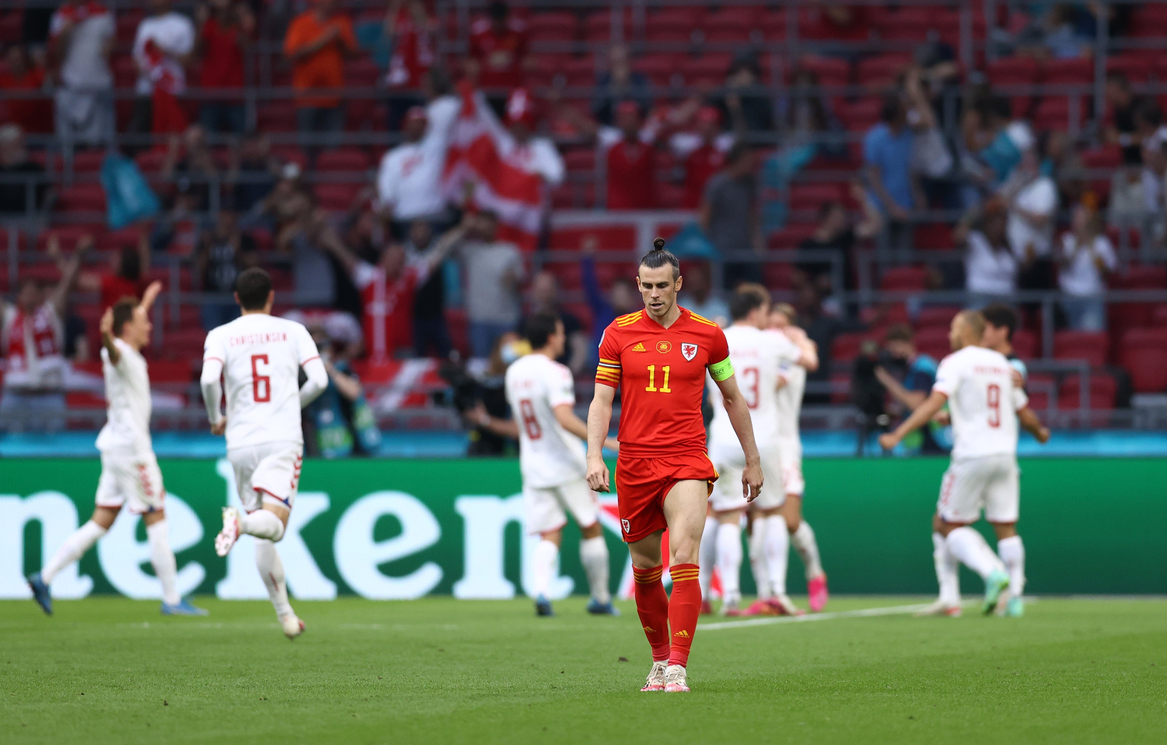 Gareth Bale walks away dejected after Denmark’s second goal