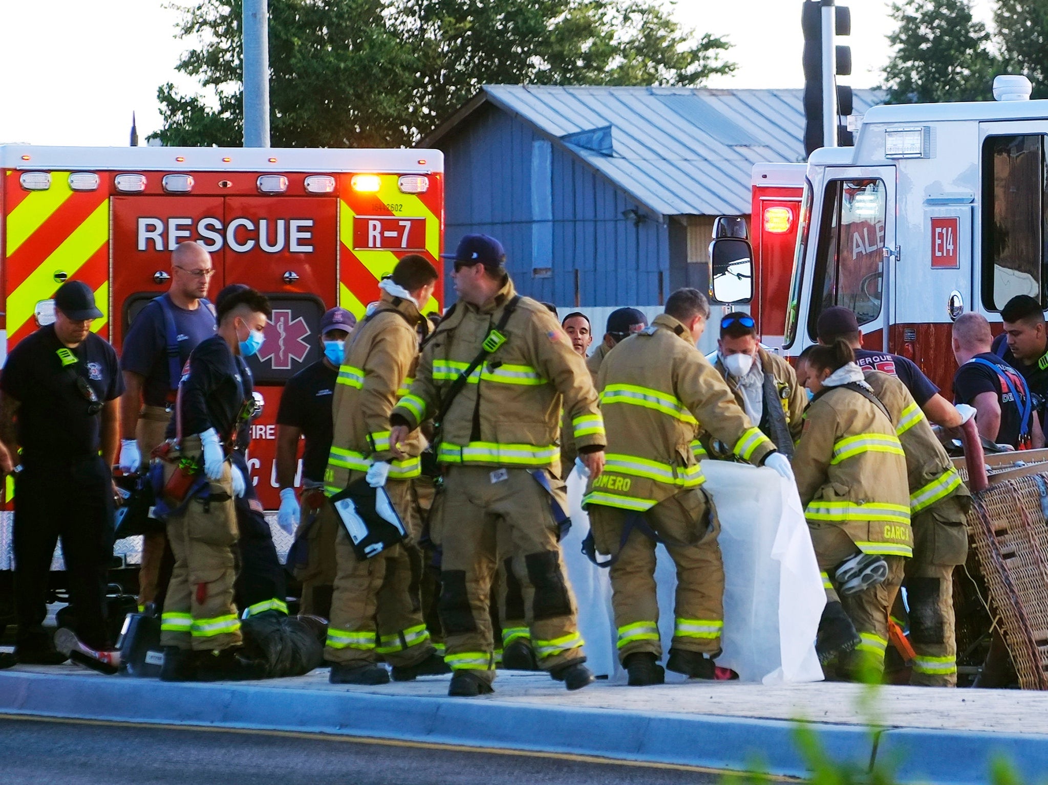 Albuquerque Fire Rescue crews work on victims of the fatal balloon crash at Unser and Central SW in Albuquerque, N.M., on Saturday, June 26, 2021