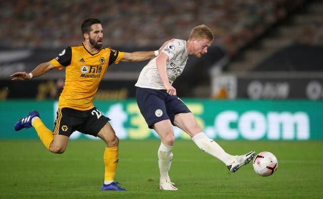 Wolves midfielder Joao Moutinho (left) and Manchester City’s Kevin De Bruyne battle for the ball