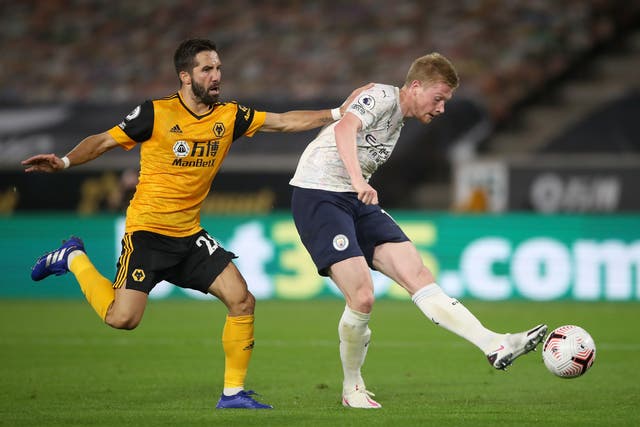Wolves midfielder Joao Moutinho (left) and Manchester City’s Kevin De Bruyne battle for the ball