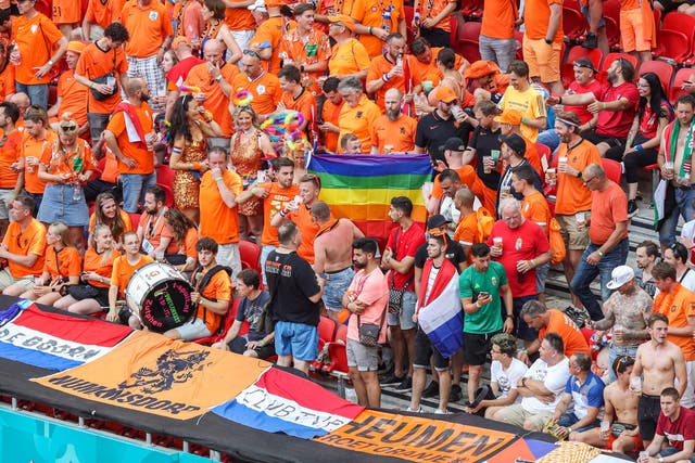 <p>Supporters of Netherlands hold a rainbow flag at the Puskas Arena in Budapest</p>