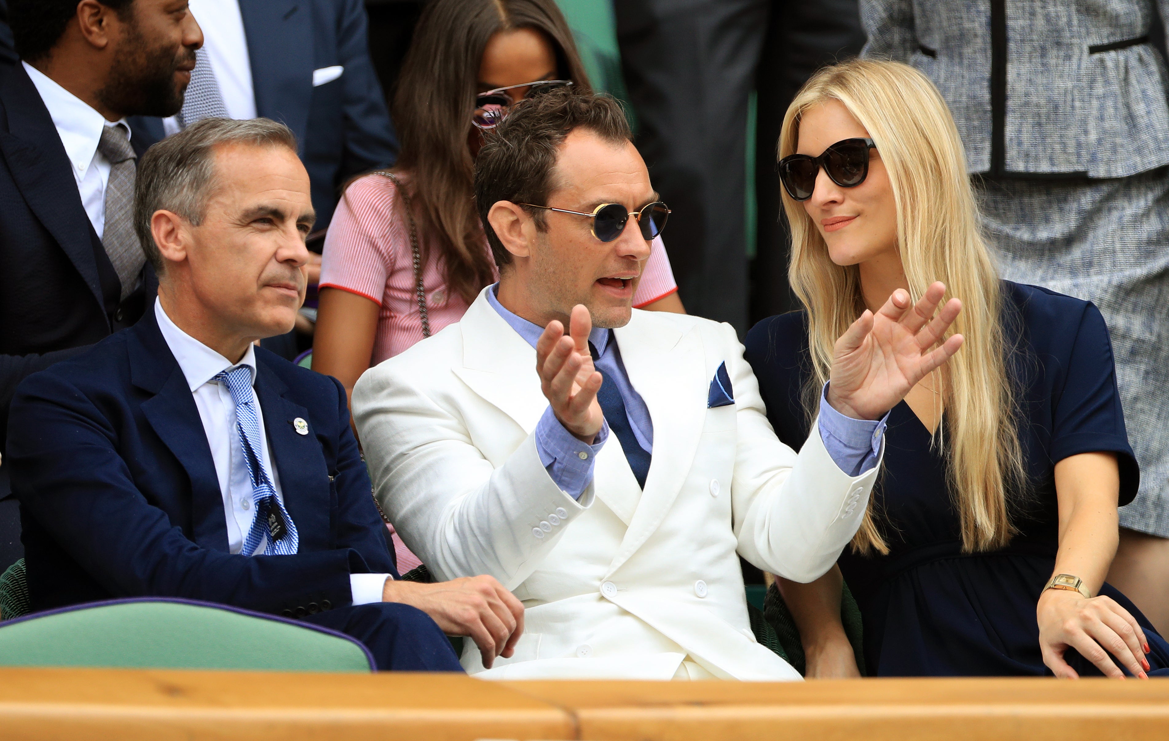 Royal Box guests (left-right) Mark Carney, Jude Law and Phillipa Coan on day eleven of the Wimbledon Championships at the All England Lawn Tennis and Croquet Club, Wimbledon