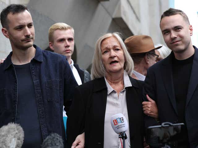 <p>Sally Challen, flanked by her sons James (left) and David, leaves the Old Bailey after hearing she will not face a retrial over the death of her husband Richard  in 2010</p>