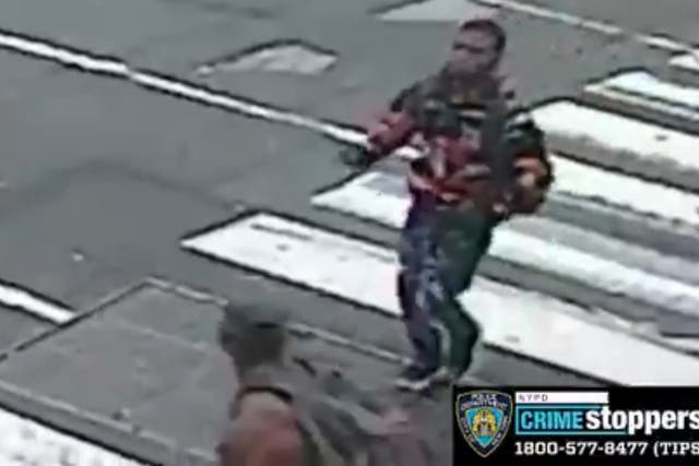 <p>A still from surveillance footage shows the suspected shooter during the incident on Sunday</p>