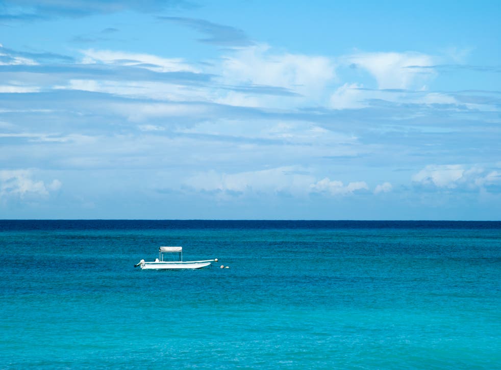 <p>A boat drifting in the Caribbean Sea, near Grand Turk Island</p>