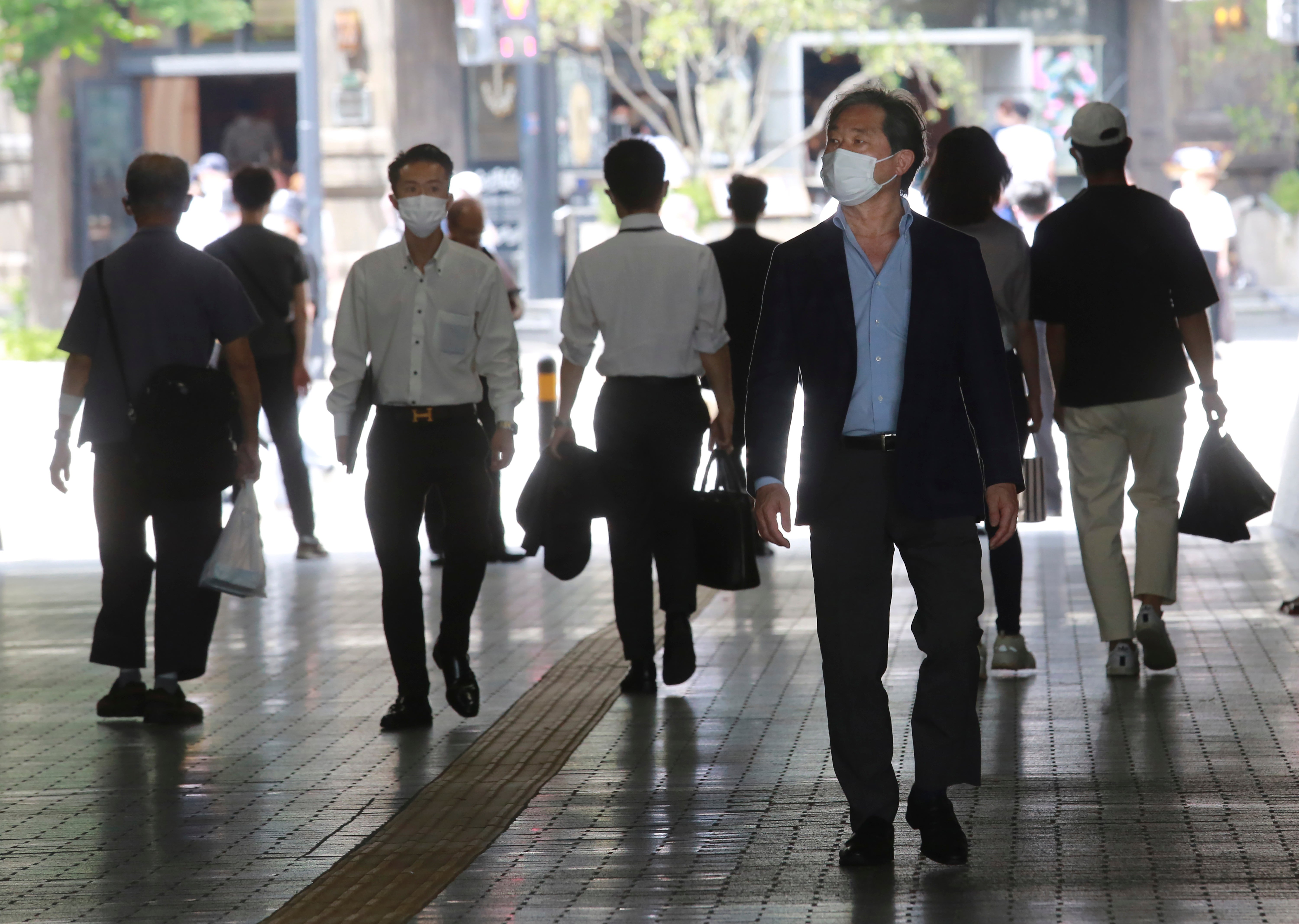‘In the UK, like Japan, we’ve become accustomed to keeping masks in our pockets and wearing them when we come into close contact with other people’