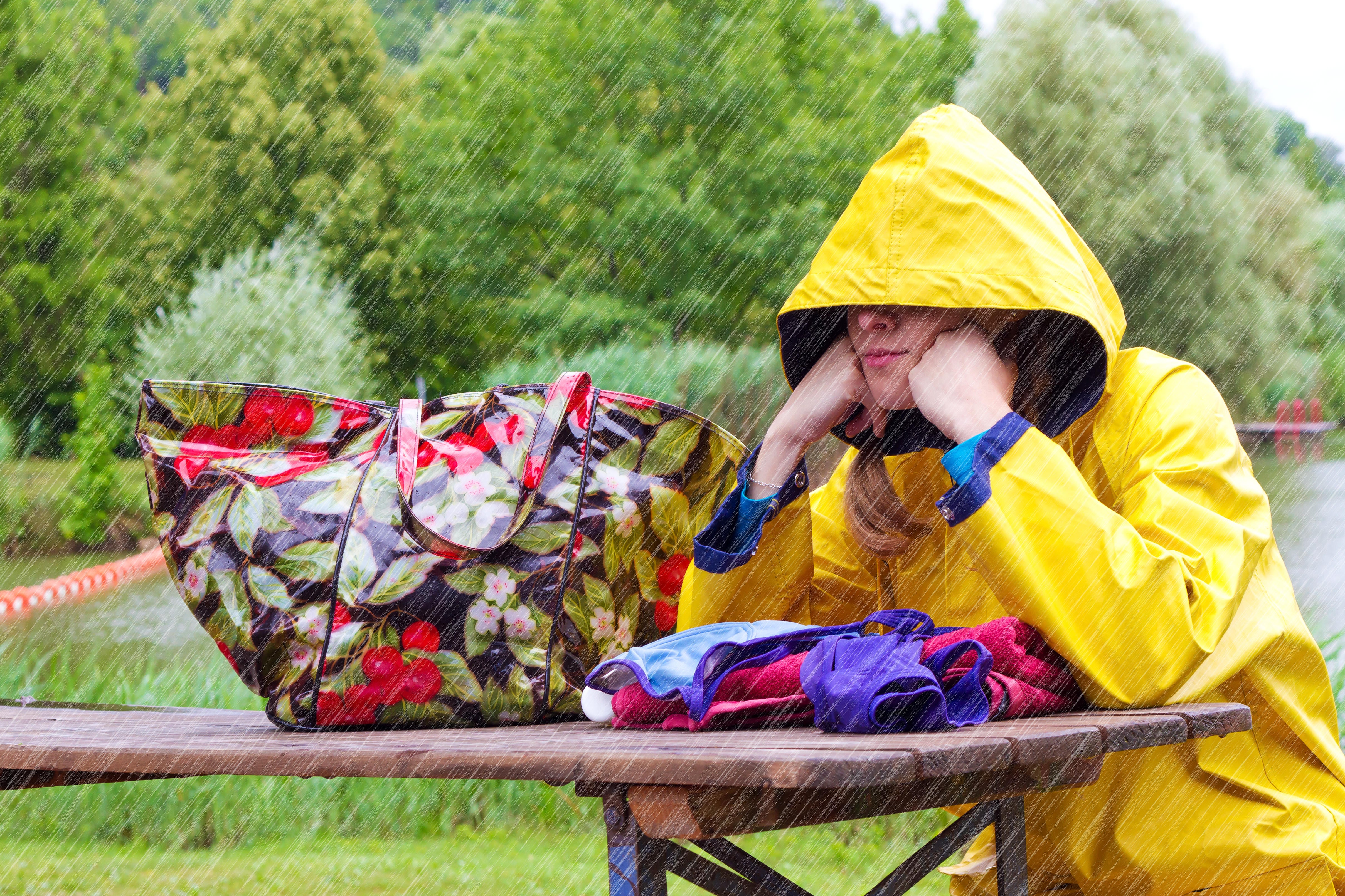 woman sitting outside in the rain