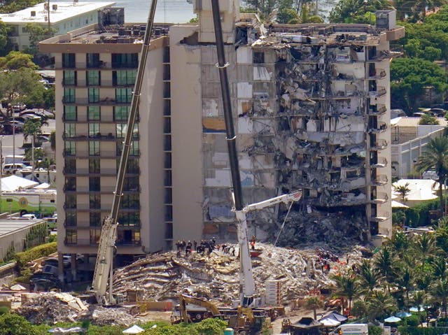 <p>This aerial image shows an oceanfront condo building that partially collapsed three days earlier, resulting in fatalities and many people still unaccounted for, in Surfside, Florida on 27 June 2021</p>