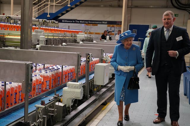 <p>Queen Elizabeth II during a visit to AG Barr's factory in Cumbernauld, where the Irn-Bru drink is manufactured, as part of her traditional trip to Scotland for Holyrood Week</p>