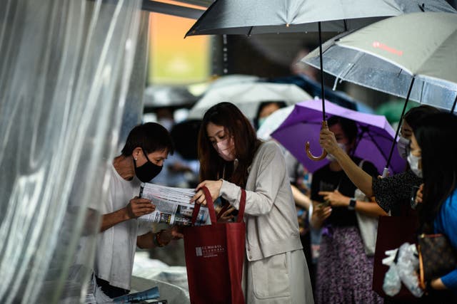 <p>A customer buys the final issue of the Apple Daily newspaper in Hong Kong on 24 June, 2021. </p>