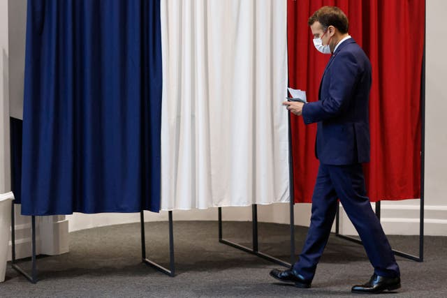 <p>French president Emmanuel Macron votes in the regional election in Le Touquet on 27 June</p>