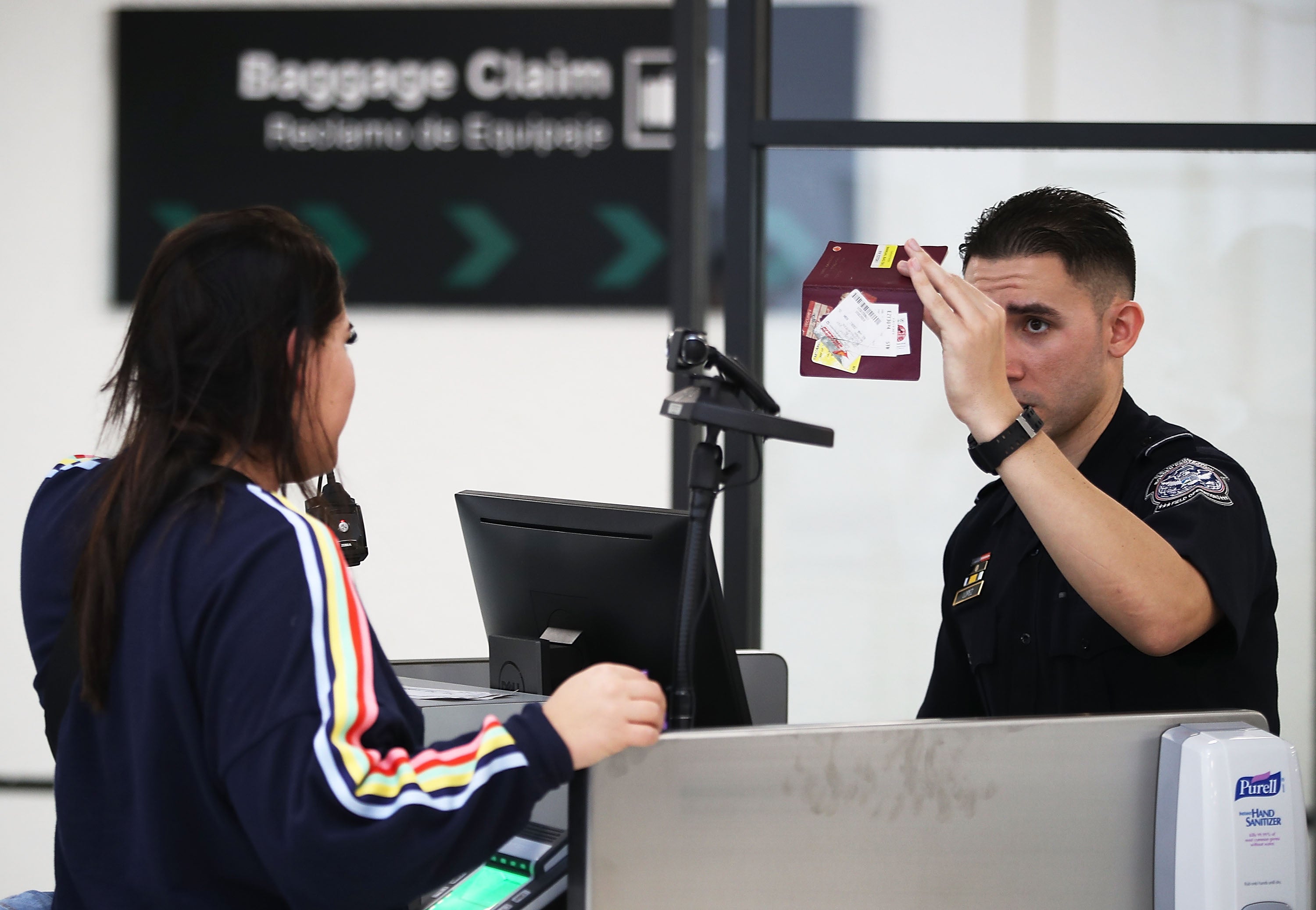 A US Customs and Border Protection officer uses facial recognition technology in his booth at Miami International Airport to screen a traveler entering the United States on 27 February, 2018 in Miami, Florida. TSA has screened the highest number of travellers since March, 2020.