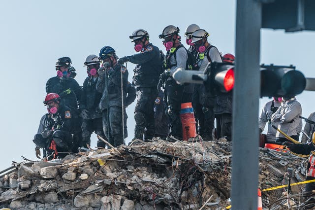 <p>Search and Rescue teams look for possible survivors in the partially collapsed 12-story Champlain Towers South condo building on June 28, 2021 in Surfside, Florida. </p>