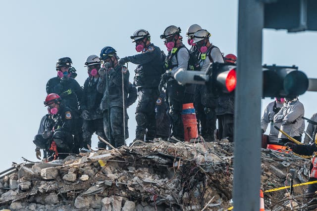 <p>Search and Rescue teams look for possible survivors in the partially collapsed 12-story Champlain Towers South condo building on June 28, 2021 in Surfside, Florida. </p>