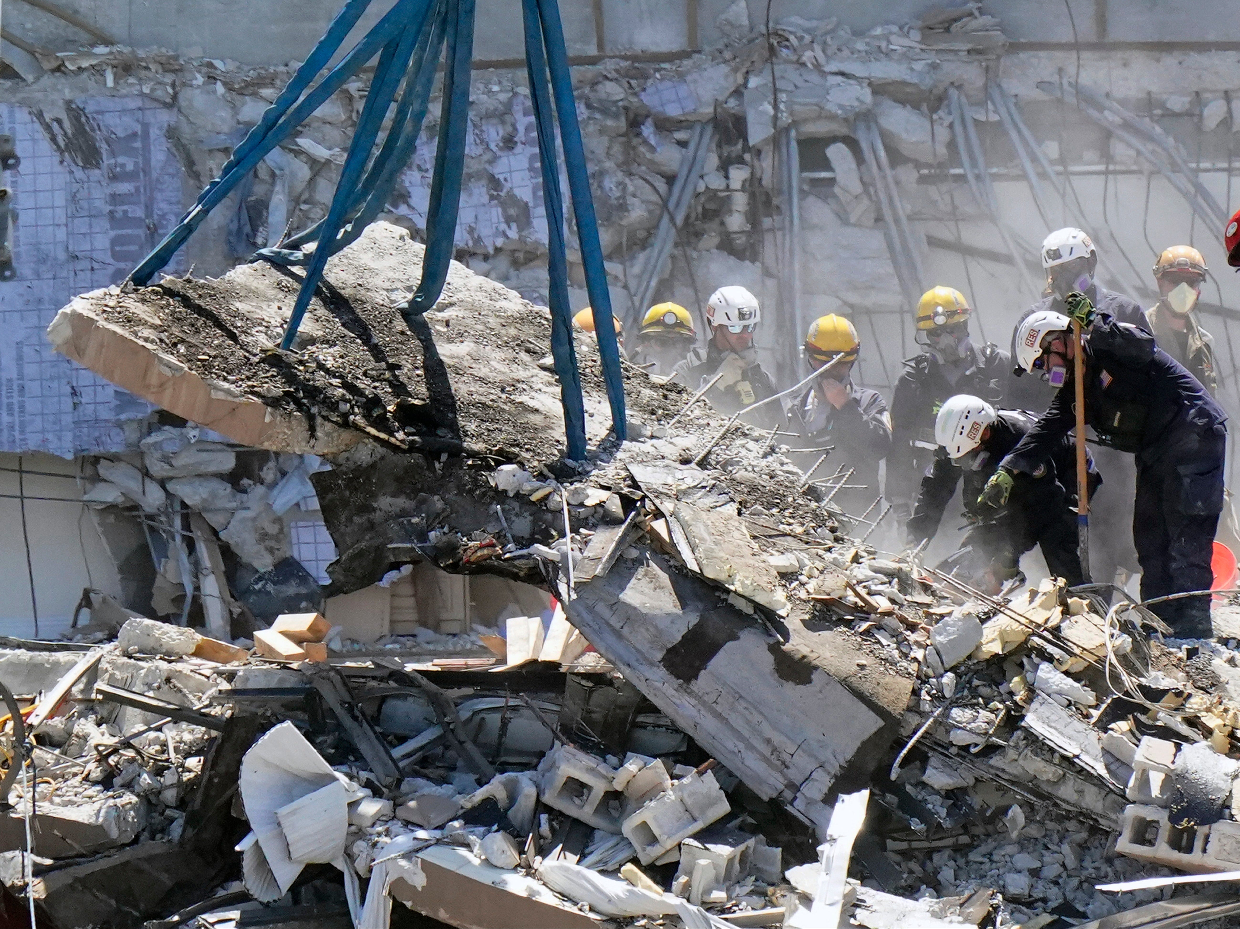 Crews work in the rubble at the Champlain Towers South