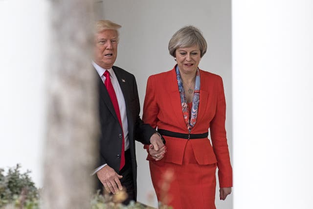 <p>British Prime Minister Theresa May and U.S. President Donald Trump walk along The Colonnade of the West Wing at The White House on January 27, 2017 in Washington, DC. </p>