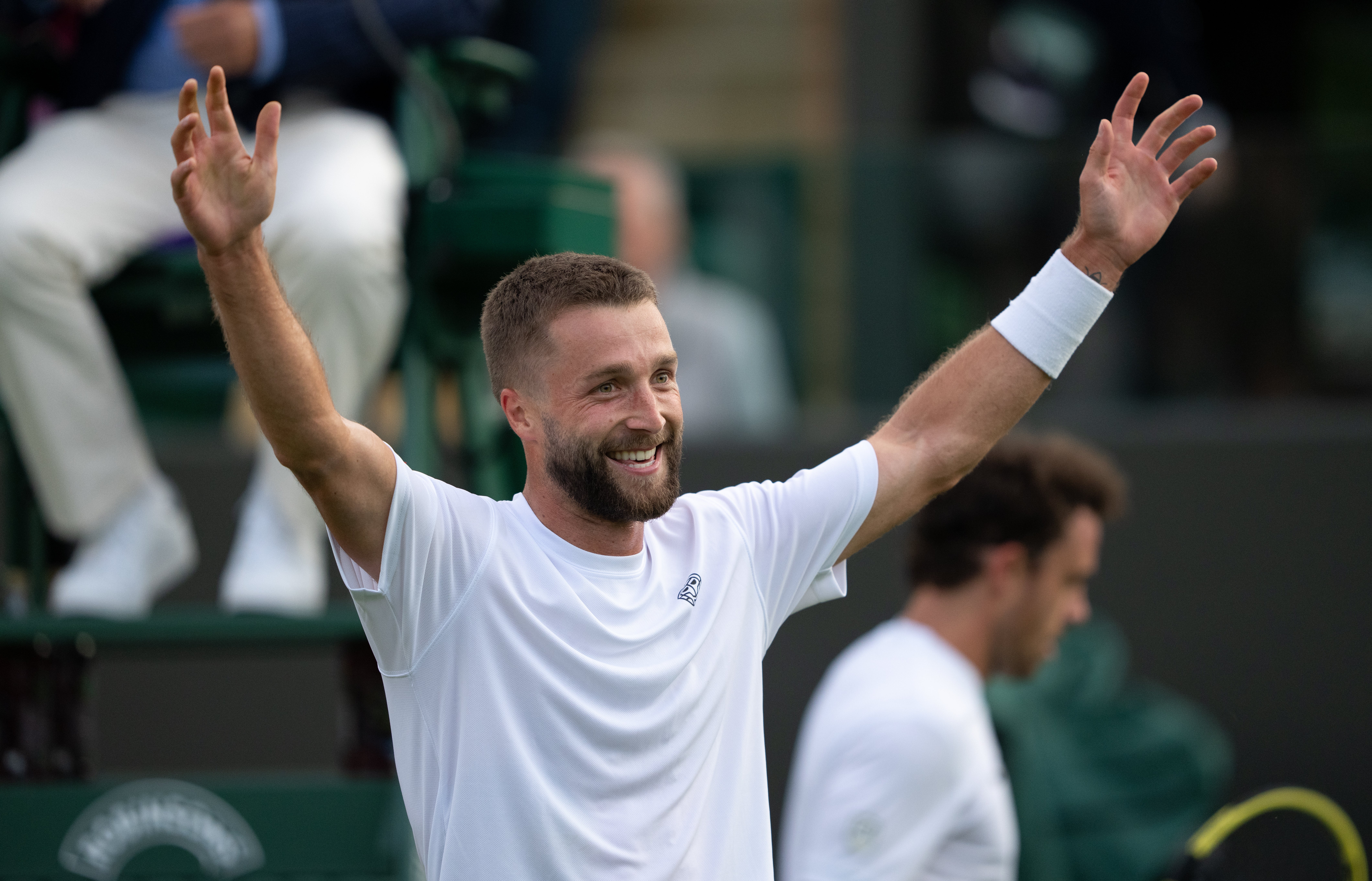Liam Broady celebrates after defeating Marco Cecchinato at Wimbledon