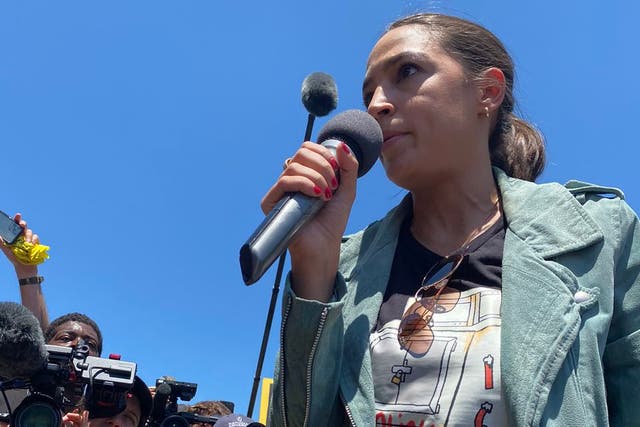 <p>Congresswoman Alexandria Ocasio-Cortez speaks at Monday’s rally hosted by the Sunrise Movement.</p>