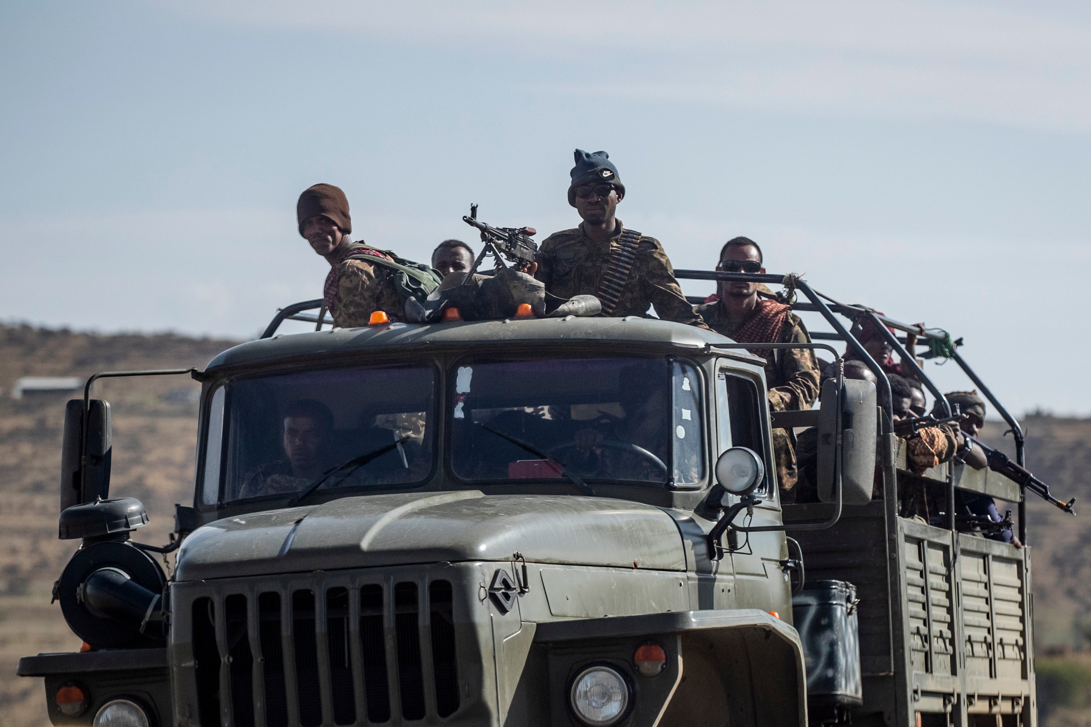 Ethiopian government soldiers ride in the back of a truck on a road near Agula, north of Mekelle, in early May