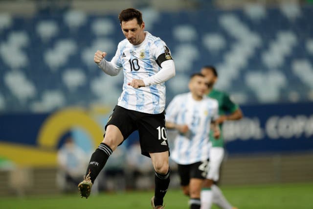 <p>Lionel Messi celebrates after scoring against Bolivia</p>