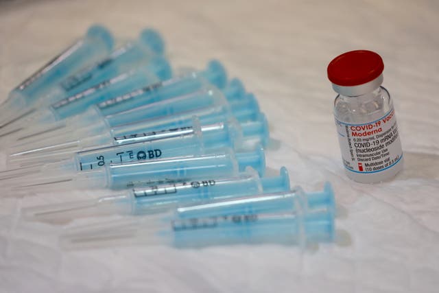 <p>File: A vial containing doses of the Moderna vaccine seen at a vaccination centre in Spain on 9 June, 2021</p>