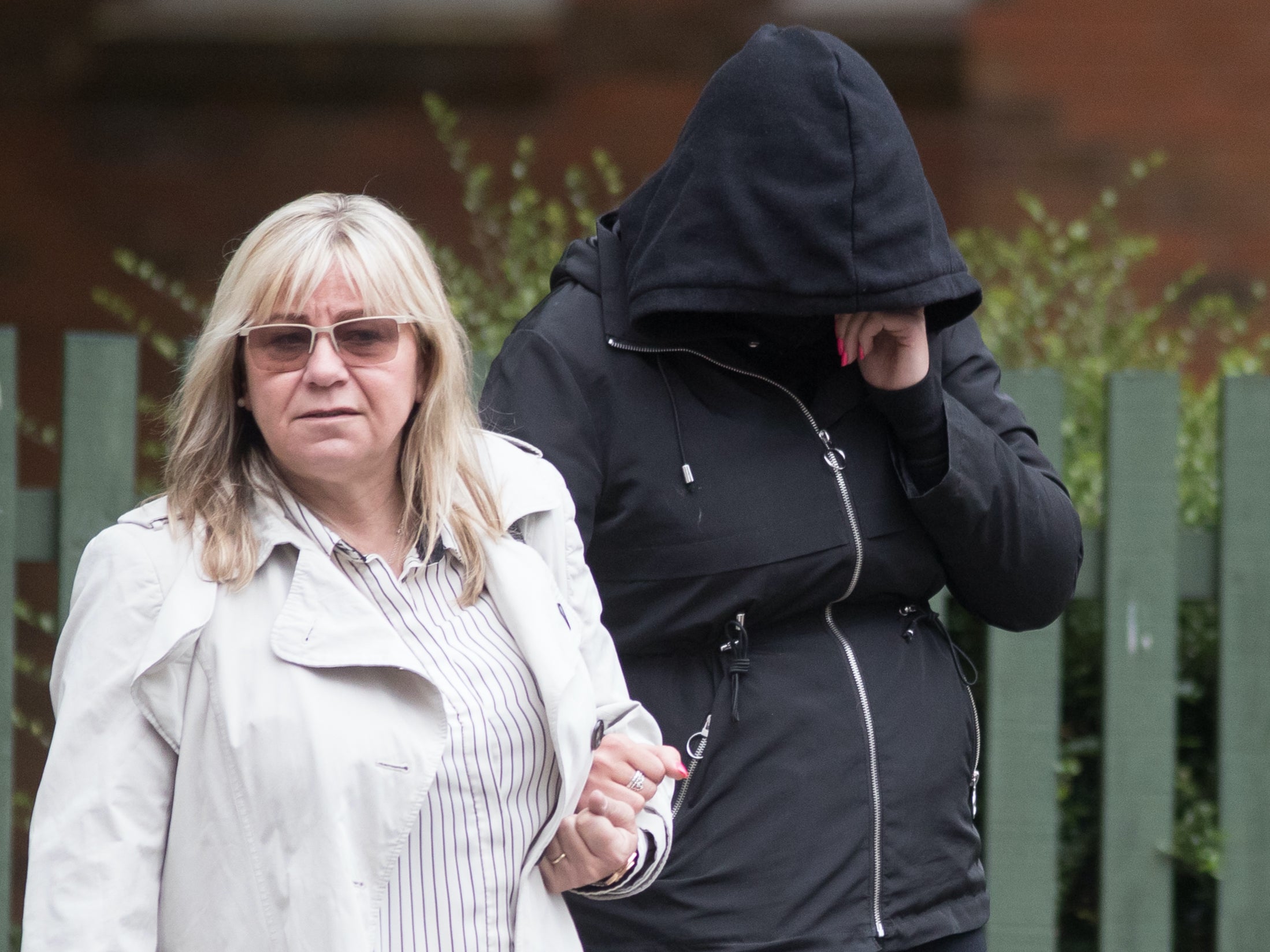 Hannah Cobley (right) leaves Leicester Crown Court with an unidentified woman in May 2019.