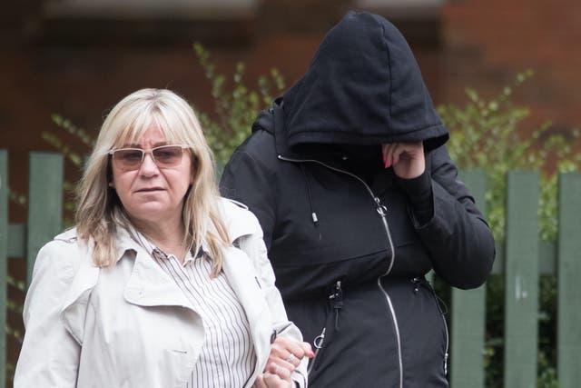 <p>Hannah Cobley (right) leaves Leicester Crown Court with an unidentified woman in May 2019. </p>