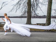 Woman runs almost 300 miles in wedding dress to raise money for domestic abuse victims