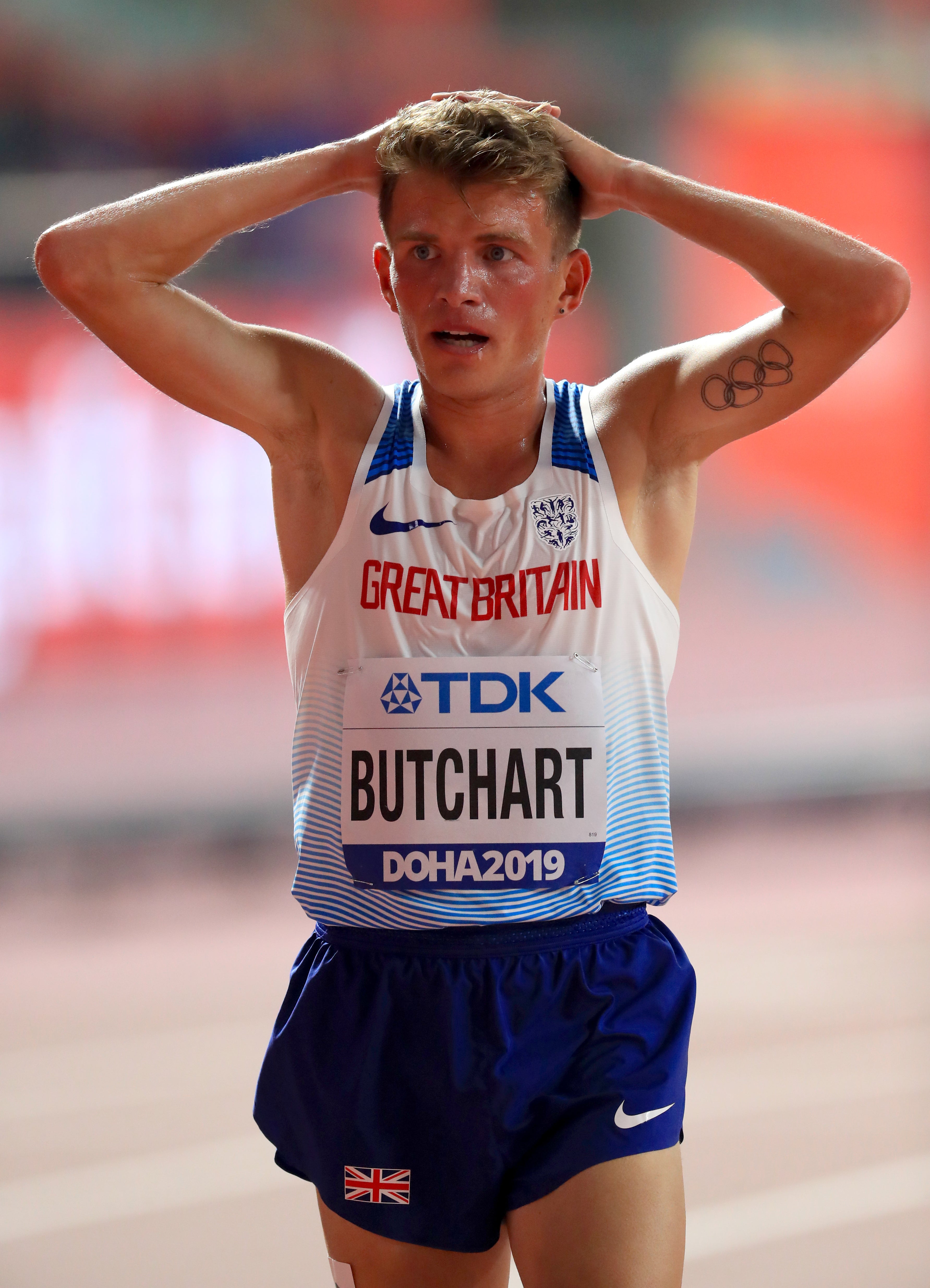 Andrew Butchart holds his head in his hands